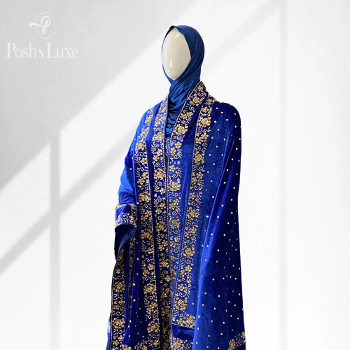 sapphire gold velvet shawl woman wearing a blue hand embroidered shawl. The shawl features double embroidered border on all four edges of the velvet shawl.